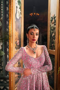 Fahad Hussayn Bagaai pink net bridal lehenga choli featuring intricate resham embroidery, fine sequin detailing, elaborate zardozi work, and hand-placed crystals on a delicate net fabric base, with a flowing embroidered lehenga, coordinated choli, and matching dupatta, perfect for wedding ceremonies, receptions, and grand bridal events.