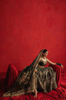 Mohsin Naveed Ranjha Gul-e-Khaas dark green Indian silk lehenga choli featuring a floral printed sleeveless choli with golden embroidery along the neckline and straps, paired with a lehenga layered with appliqués, block-printed motifs, gota patti, mirror work, hand embroidery, and spade-inspired geometric patterns with an ornate golden threadwork hemline, complete with an organza dupatta blooming with printed florals, gota patti, adda work, embroidered borders, kiran trims, and delicate tassels, perfect for