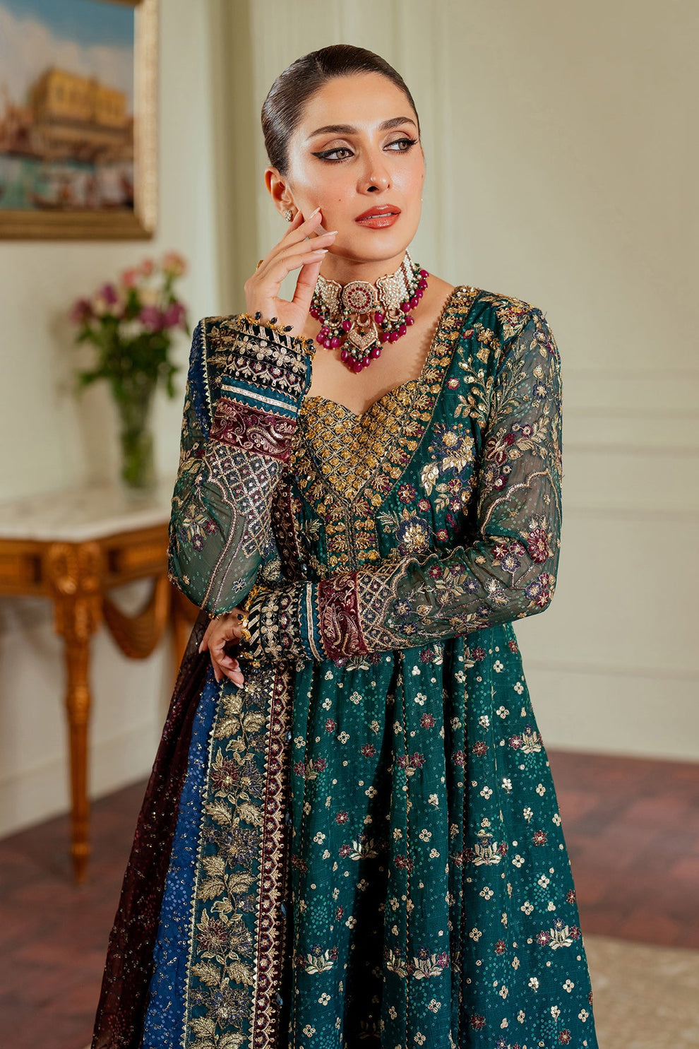 Baroque Chantelle embroidered chiffon three-piece ensemble featuring a digital chunri print with hand-embellished gotta, nakshi, and copper tilla at the neckline, adorned with sequins and embroidered borders, paired with a printed chiffon dupatta with organza and velvet embroidered border and dyed silk trousers, perfect for formal occasions and festive wear.