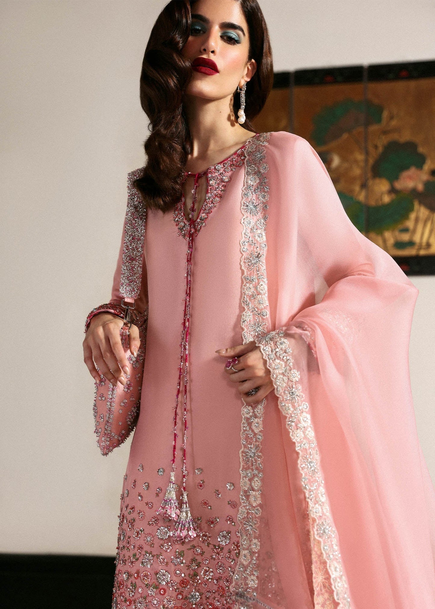 Hussain Rehar Evara ensemble featuring intricate embellishments with refined detail on rich flowing fabric in a statement silhouette with bold accents and a perfectly tailored cut, paired with a graceful dupatta, perfect for weddings and formal occasions.