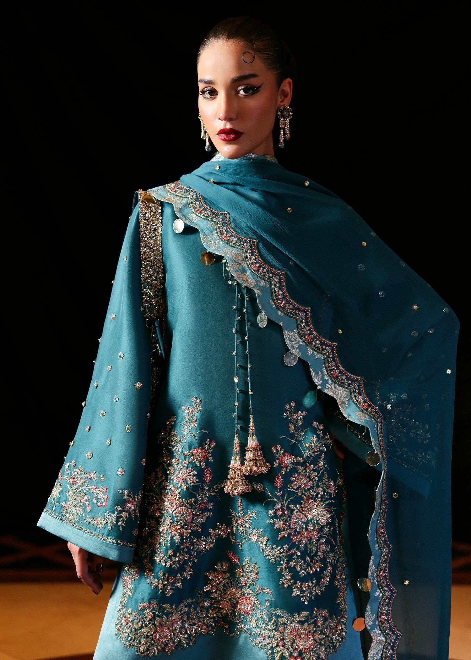 Hussain Rehar Verta ensemble featuring a refined silhouette with intricate embellishments and luxurious fabric in a fluid drape, paired with a beautifully detailed dupatta, perfect for formal occasions and elegant celebrations.