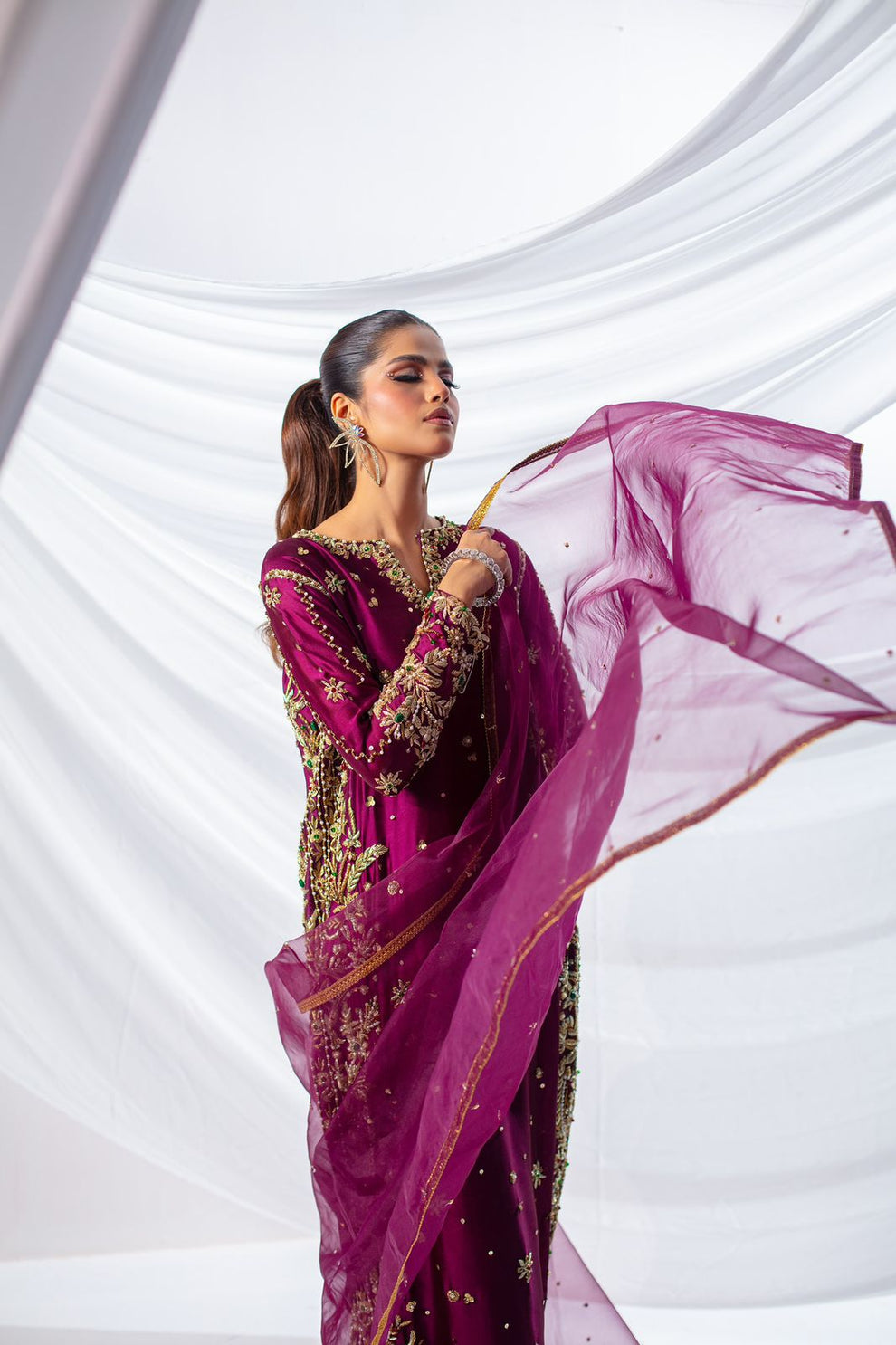 Batik Expressive Magenta dreamy magenta ensemble featuring a straight long heavily embellished shirt with zardozi techniques, stones, and beading, perfect for wedding festivities and formal occasions.