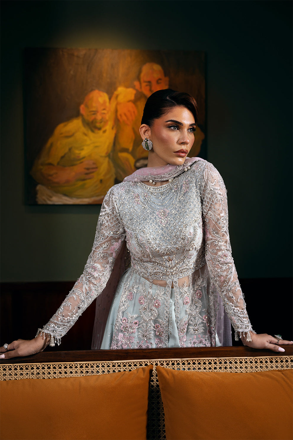 Saira Rizwan Kylo unstitched net ensemble featuring embroidered sequined and embellished front, back, sleeves, and panels, paired with an embroidered sequined net dupatta and raw silk lehenga with lining, perfect for weddings and formal occasions.