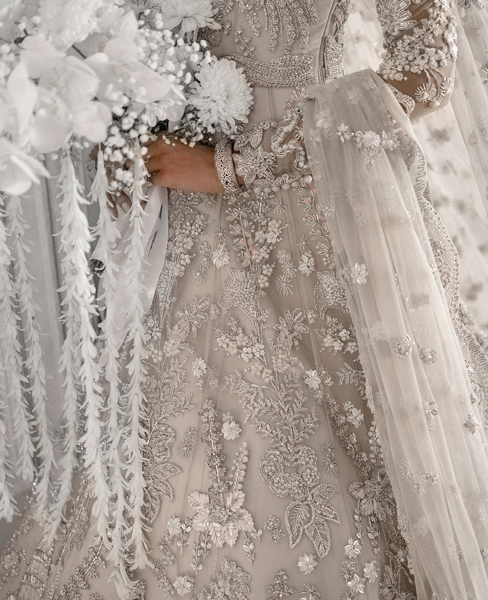  Republic Womenswear E-52 modern glamour ensemble featuring intricate embellishments and artful embroidery on luxurious fabric with a flattering flowing silhouette, perfect for galas, special occasions, and formal events.
