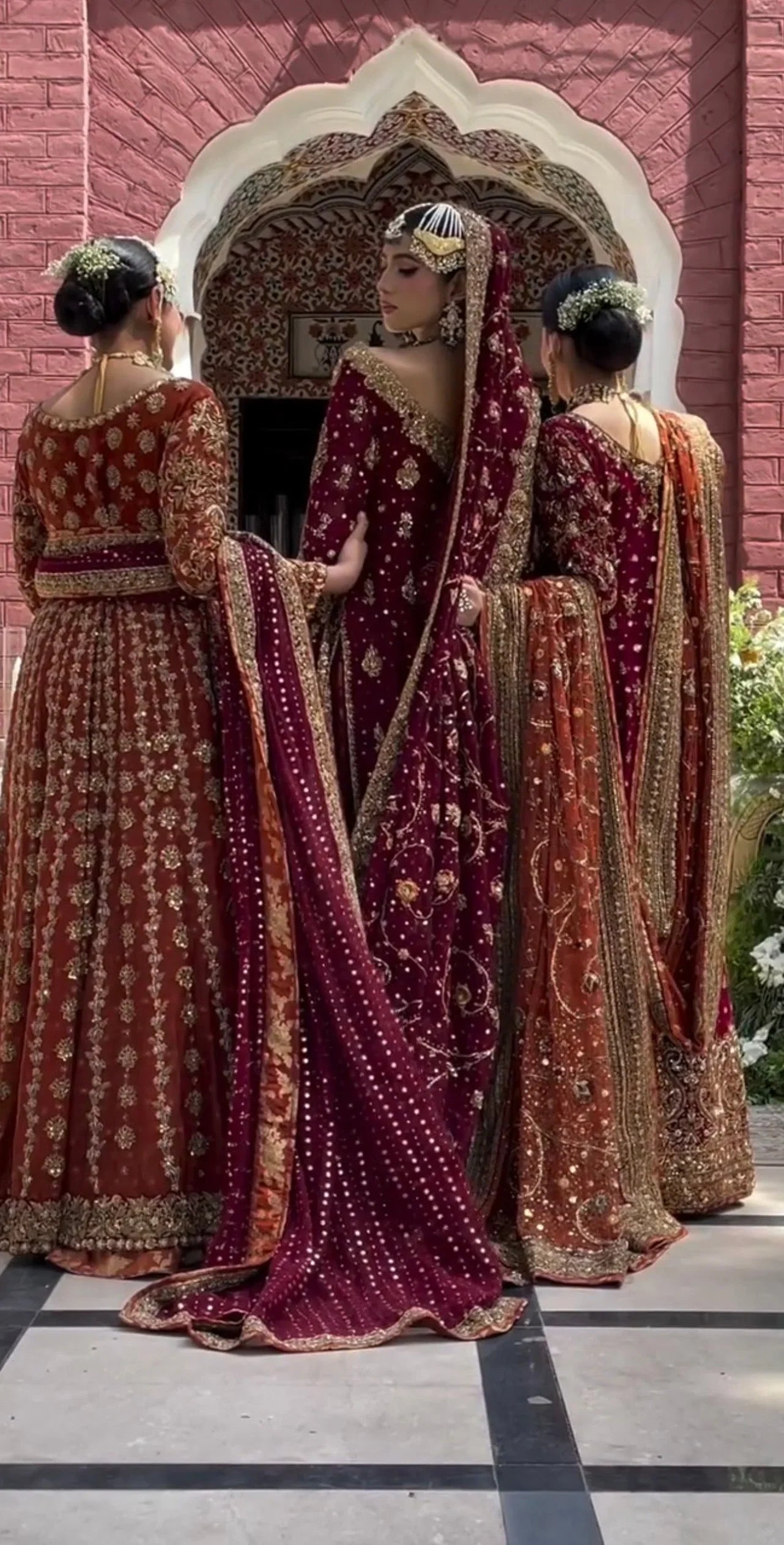 Haris Shakeel Ishq Series bridal ensemble in deep romantic maroon featuring intricate adda work and hand embellishment with fine dabka and handworked motifs spread generously across the shirt, sleeves, and flowing lehenga with richly embellished borders, paired with a heavily worked dupatta with ornate edging, perfect for brides seeking classic sophistication and traditional grandeur.