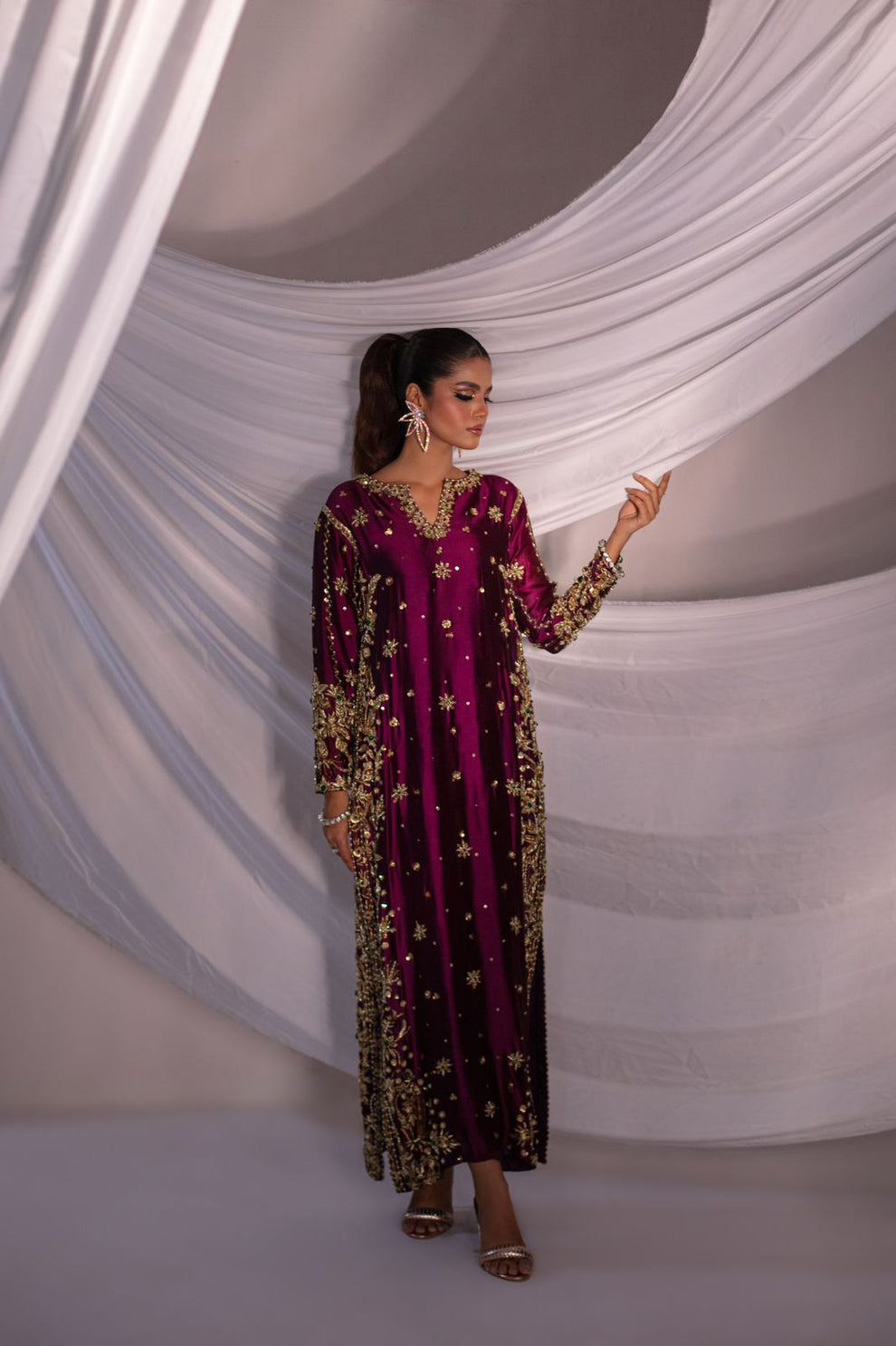 Batik Expressive Magenta dreamy magenta ensemble featuring a straight long heavily embellished shirt with zardozi techniques, stones, and beading, perfect for wedding festivities and formal occasions.