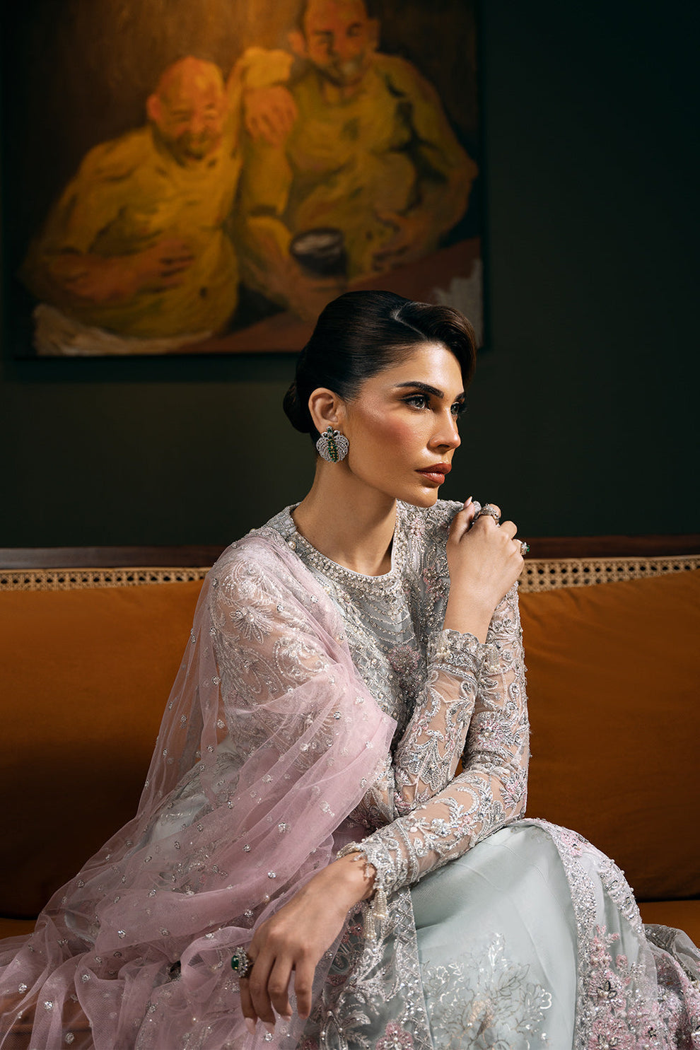 Saira Rizwan Kylo unstitched net ensemble featuring embroidered sequined and embellished front, back, sleeves, and panels, paired with an embroidered sequined net dupatta and raw silk lehenga with lining, perfect for weddings and formal occasions.