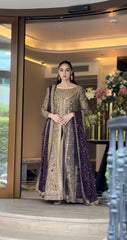 Haris Shakeel Aroha brushed bronze wedding ensemble featuring a luminous antique gold and soft champagne formal outfit with intricate hand embellishments and detailed embroidery, paired with a rich deep purple dupatta for a regal contrast, perfect for weddings, receptions, engagements, and formal celebrations.