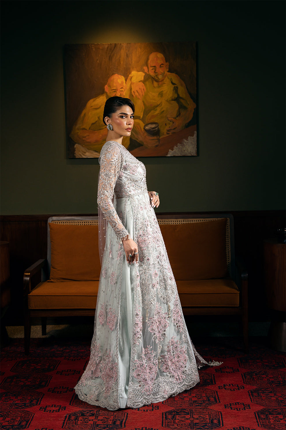 Saira Rizwan Kylo unstitched net ensemble featuring embroidered sequined and embellished front, back, sleeves, and panels, paired with an embroidered sequined net dupatta and raw silk lehenga with lining, perfect for weddings and formal occasions.
