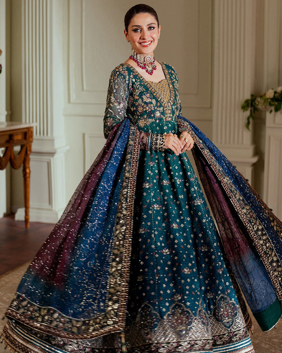Baroque Chantelle embroidered chiffon three-piece ensemble featuring a digital chunri print with hand-embellished gotta, nakshi, and copper tilla at the neckline, adorned with sequins and embroidered borders, paired with a printed chiffon dupatta with organza and velvet embroidered border and dyed silk trousers, perfect for formal occasions and festive wear.