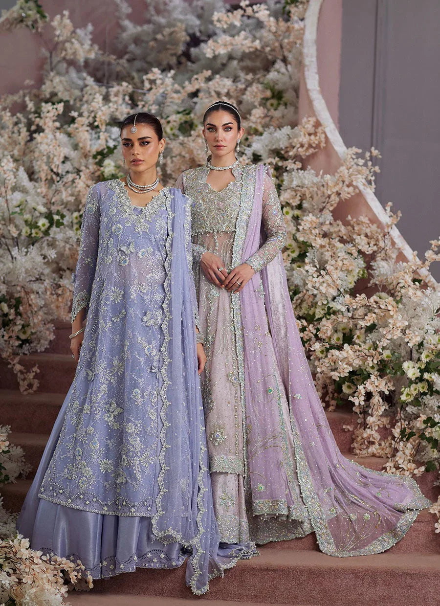 Farah Talib Aziz Elanur lilac bridal kalidaar crafted on pure net with intricate hand embellishments featuring a flared silhouette, paired with a classic lehenga and coordinated net dupatta with subtle embroidery, perfect for wedding festivities and formal celebrations.