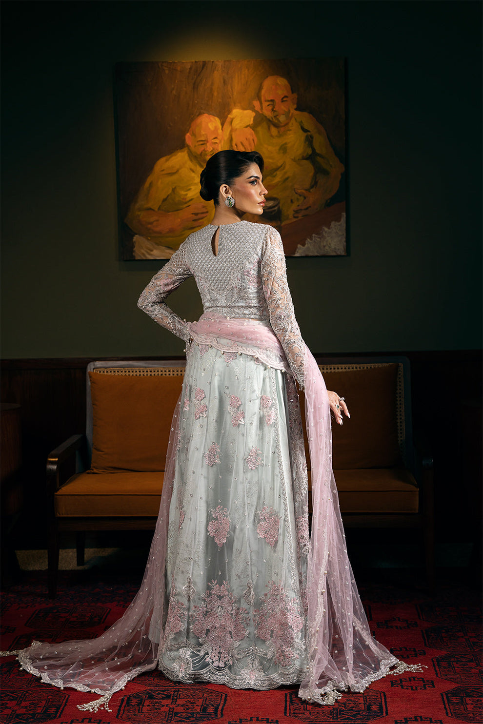 Saira Rizwan Kylo unstitched net ensemble featuring embroidered sequined and embellished front, back, sleeves, and panels, paired with an embroidered sequined net dupatta and raw silk lehenga with lining, perfect for weddings and formal occasions.