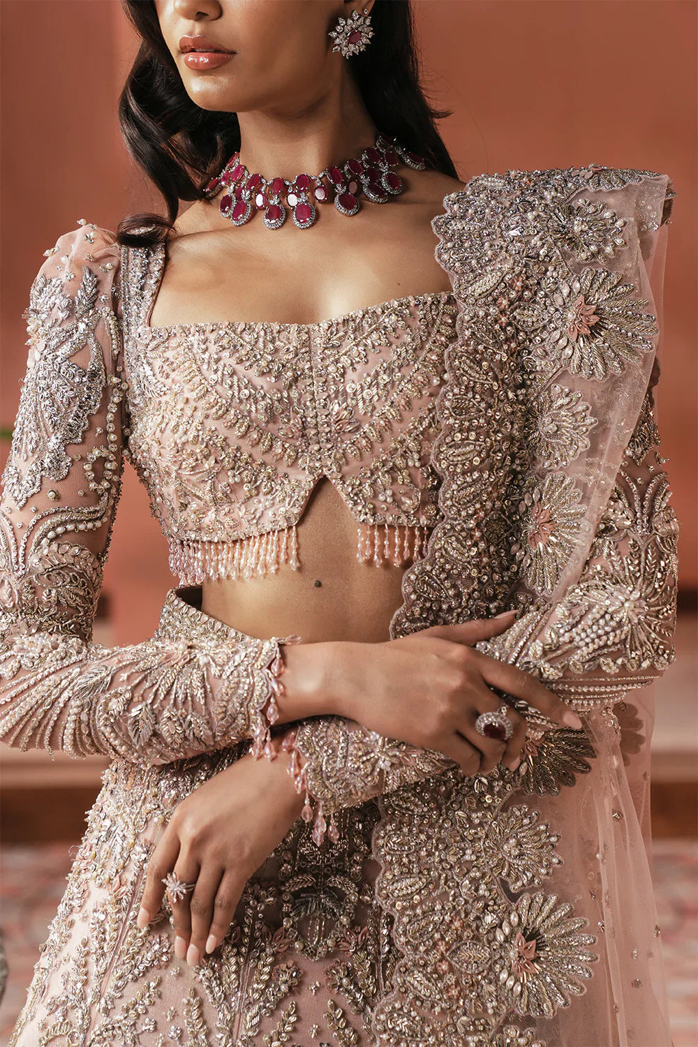 Soraya Catherine soft pink net bridal lehenga choli featuring intricate handwork with sparkling crystals, classic dabka embroidery, fine katdana detailing, and traditional mukesh work on a delicately embellished lehenga, paired with a matching net dupatta with coordinated detailing, perfect for wedding ceremonies, nikkah, and bridal receptions.