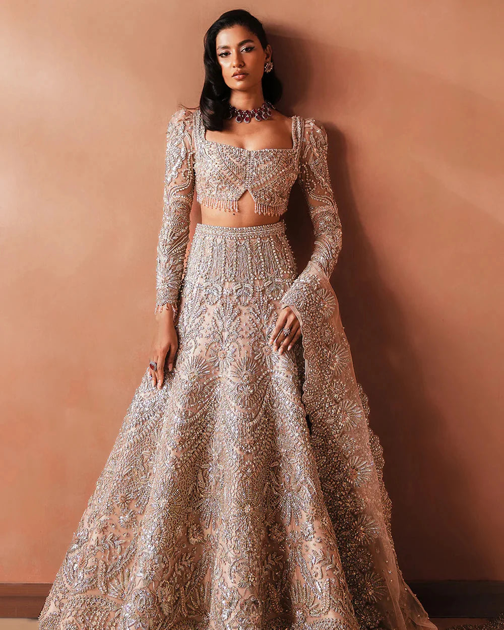 Soraya Catherine soft pink net bridal lehenga choli featuring intricate handwork with sparkling crystals, classic dabka embroidery, fine katdana detailing, and traditional mukesh work on a delicately embellished lehenga, paired with a matching net dupatta with coordinated detailing, perfect for wedding ceremonies, nikkah, and bridal receptions.