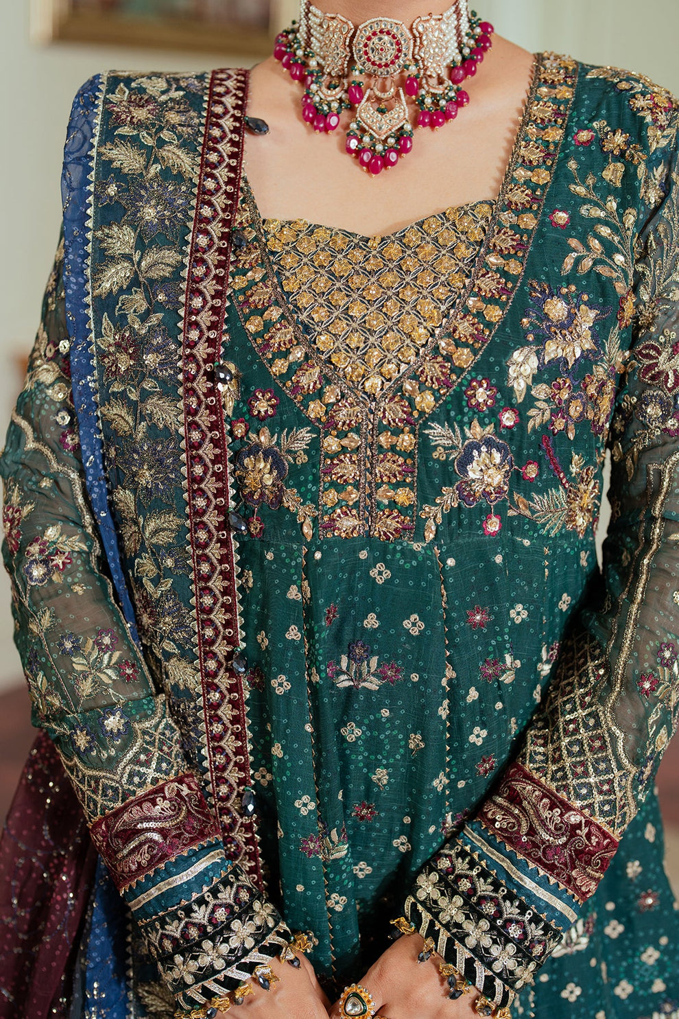 Baroque Chantelle embroidered chiffon three-piece ensemble featuring a digital chunri print with hand-embellished gotta, nakshi, and copper tilla at the neckline, adorned with sequins and embroidered borders, paired with a printed chiffon dupatta with organza and velvet embroidered border and dyed silk trousers, perfect for formal occasions and festive wear.