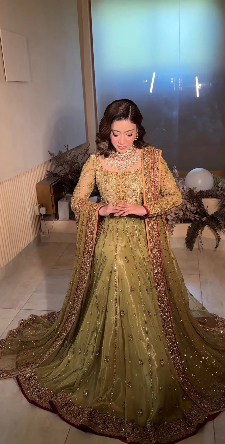 Haris Shakeel inspired pistachio green festive ensemble featuring a shirt with intricate embroidery and delicate embellishments creating a refined luminous texture, paired with a coordinated dupatta with rich contrasting borders and straight-cut trousers, perfect for wedding festivities, formal gatherings, and celebratory occasions.