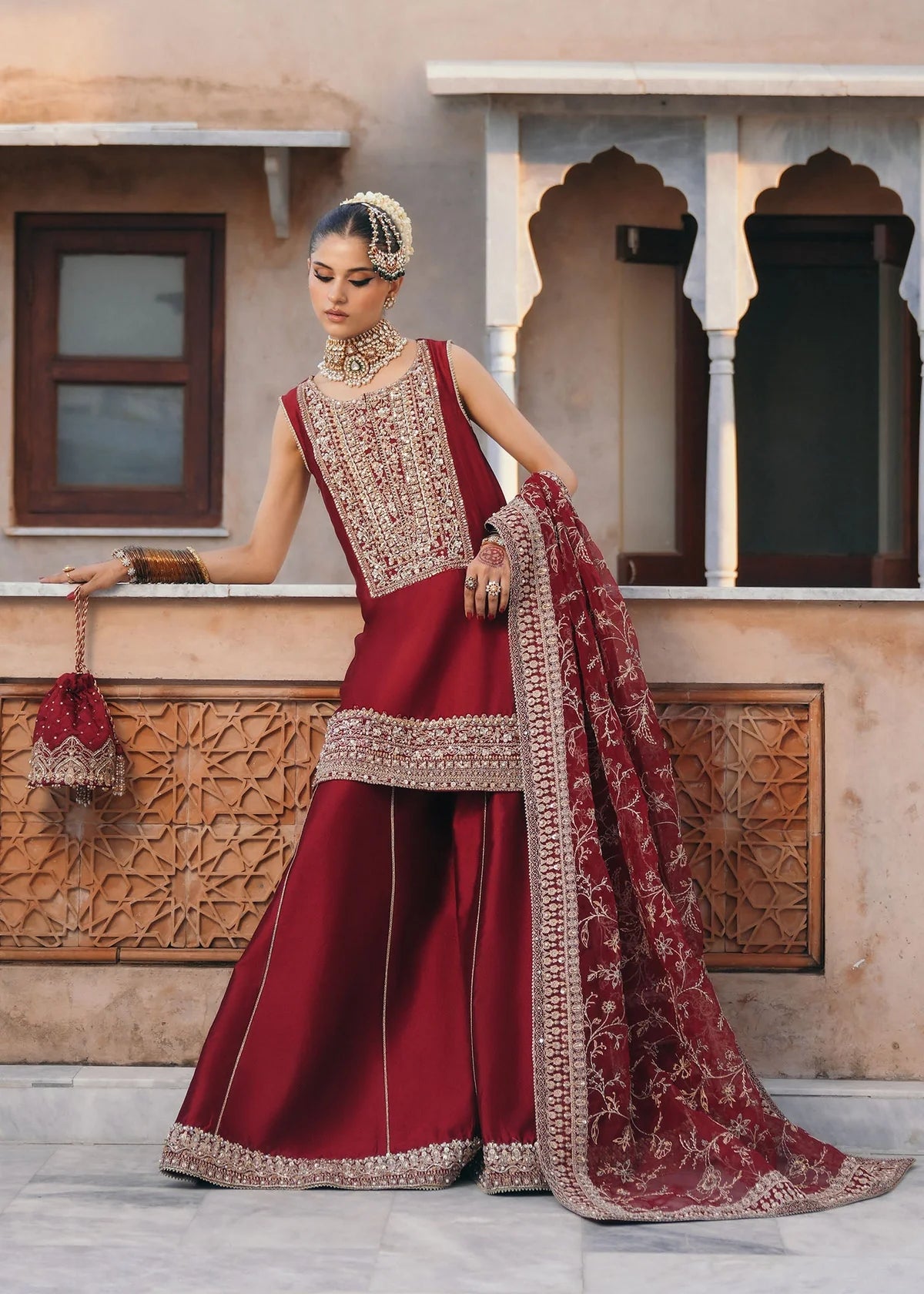 Mehek red ada embroidery Pakistani formal three-piece ensemble featuring a tissue silk shirt with a square neckline and intricate traditional embroidery, paired with matching tissue silk gharara and a kathan organza dupatta, perfect for weddings and festive celebrations.