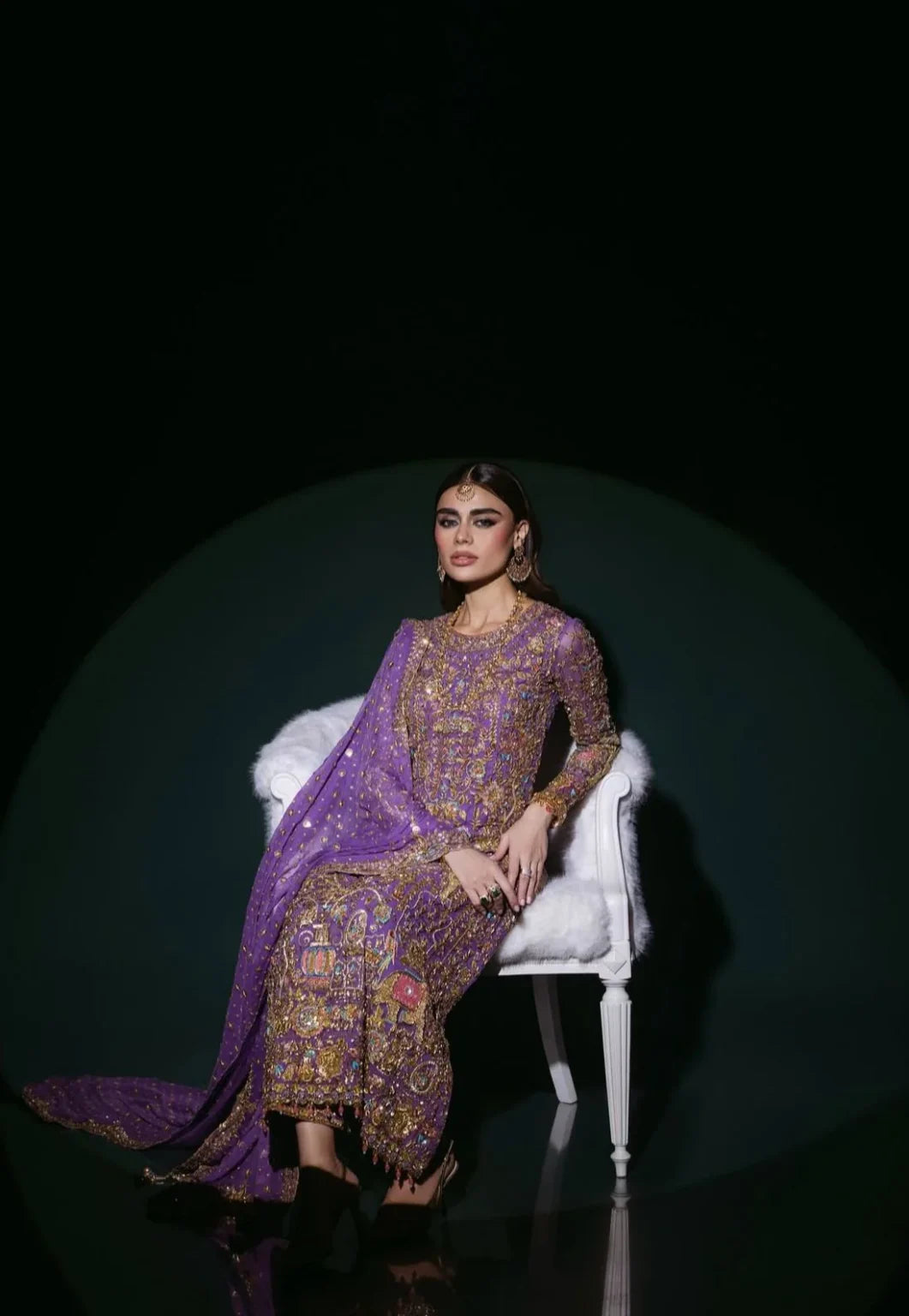 Nomi Ansari Amara Luxe rich purple formal ensemble featuring heavy hand embellishments with a harmonious blend of floral and animal-inspired patterns, bejeweled detailing, fine bordered ezaar work, and a long flowing dupatta with intricate cutwork, perfect for weddings, receptions, and festive celebrations.