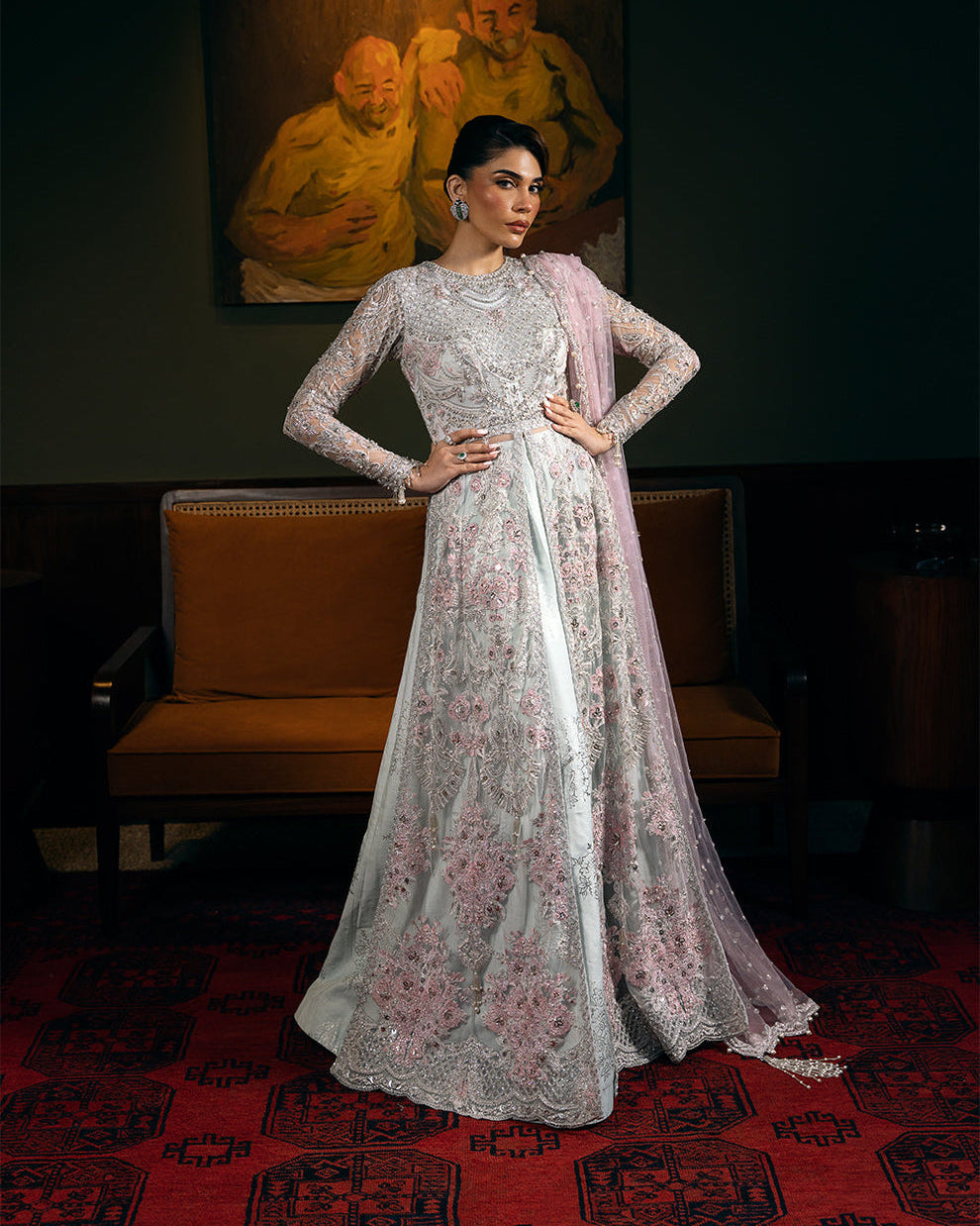 Saira Rizwan Kylo unstitched net ensemble featuring embroidered sequined and embellished front, back, sleeves, and panels, paired with an embroidered sequined net dupatta and raw silk lehenga with lining, perfect for weddings and formal occasions.