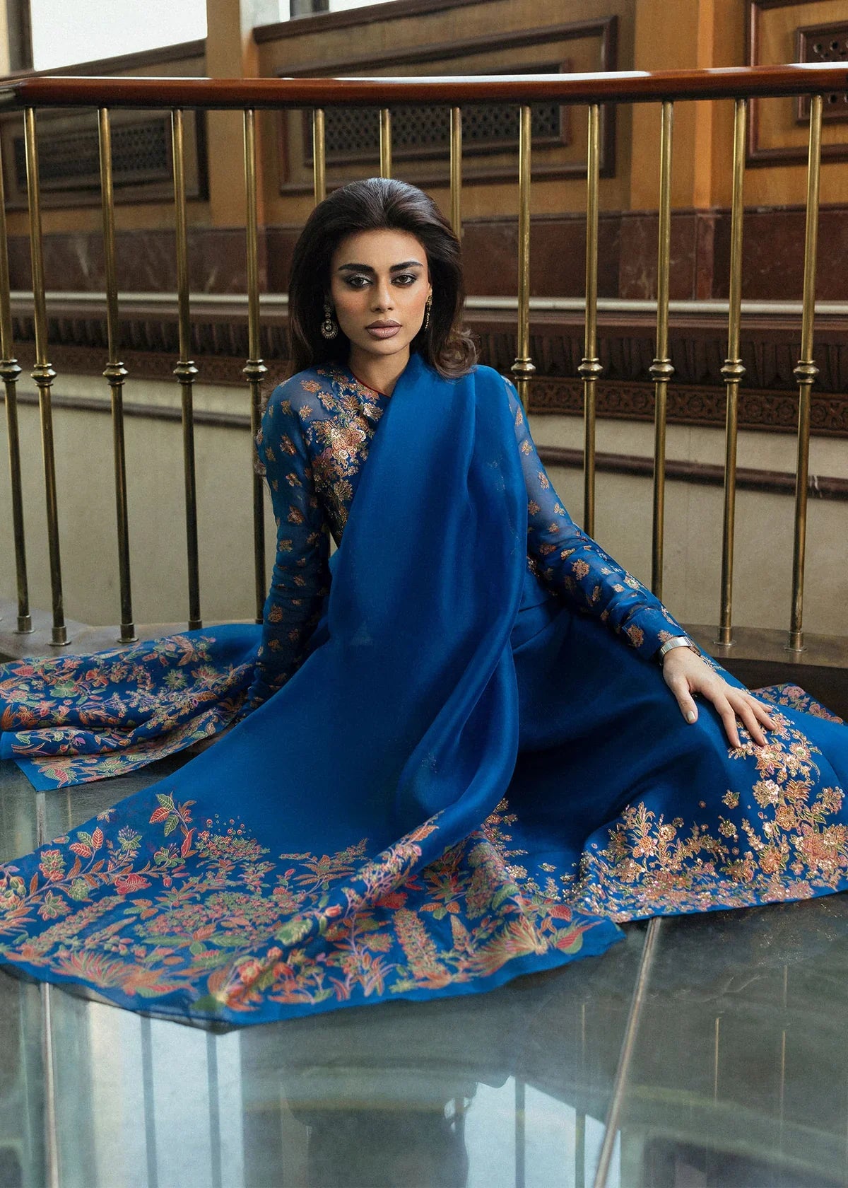 Hussain Rehar Serene teal blue raw silk shirt featuring vibrant screen-printed details with delicate embellishments and chic raglan sleeves in sheer screen-printed organza, paired with plain culottes and a matching screen-printed dupatta, perfect for festive gatherings and semi-formal events.