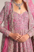  Fahad Hussayn Bagaai pink net bridal lehenga choli featuring intricate resham embroidery, fine sequin detailing, elaborate zardozi work, and hand-placed crystals on a delicate net fabric base, with a flowing embroidered lehenga, coordinated choli, and matching dupatta, perfect for wedding ceremonies, receptions, and grand bridal events.