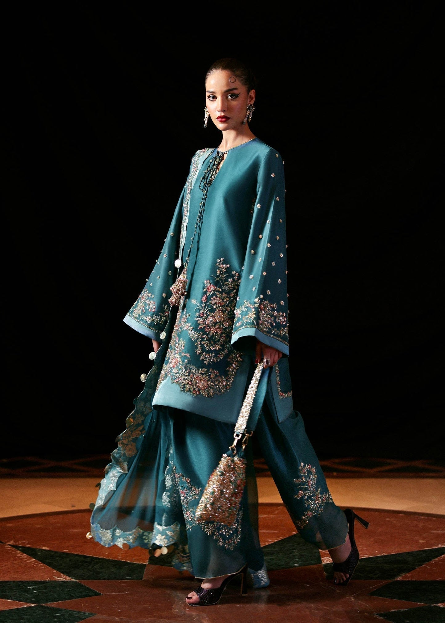 Hussain Rehar Verta ensemble featuring a refined silhouette with intricate embellishments and luxurious fabric in a fluid drape, paired with a beautifully detailed dupatta, perfect for formal occasions and elegant celebrations.