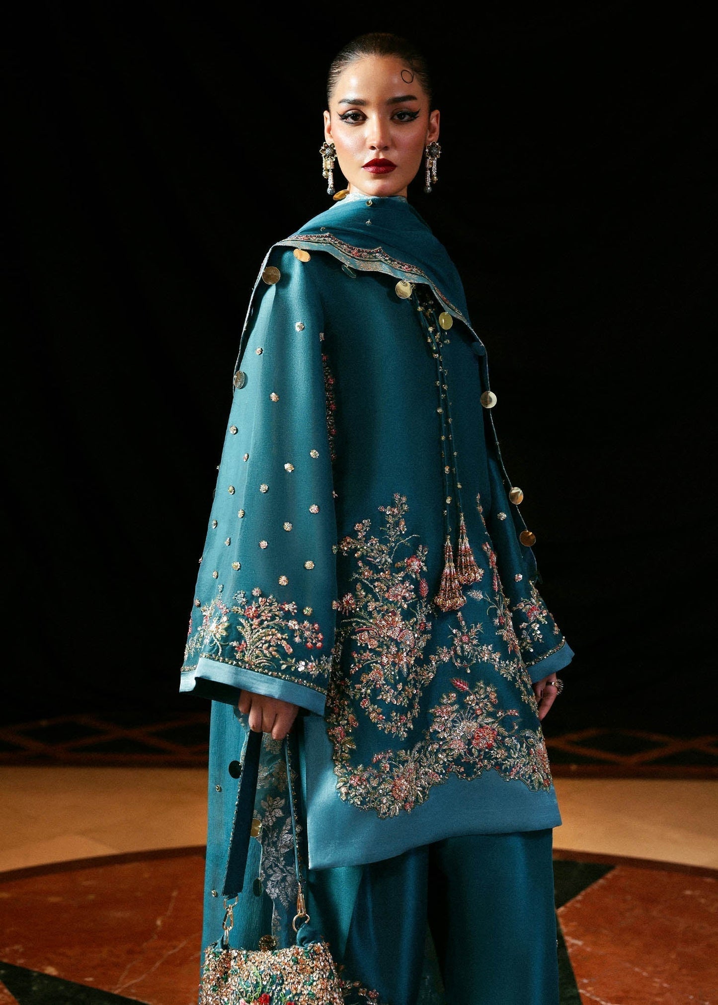 Hussain Rehar Verta ensemble featuring a refined silhouette with intricate embellishments and luxurious fabric in a fluid drape, paired with a beautifully detailed dupatta, perfect for formal occasions and elegant celebrations.