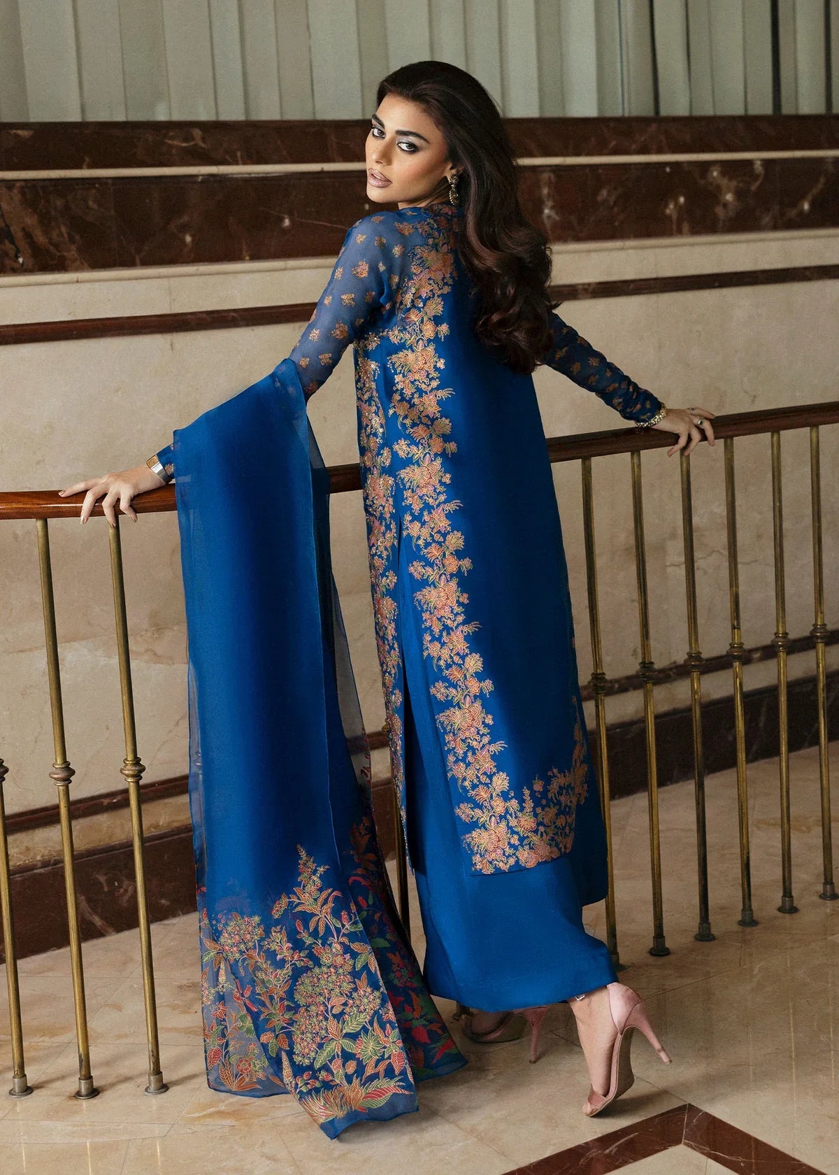 Hussain Rehar Serene teal blue raw silk shirt featuring vibrant screen-printed details with delicate embellishments and chic raglan sleeves in sheer screen-printed organza, paired with plain culottes and a matching screen-printed dupatta, perfect for festive gatherings and semi-formal events.